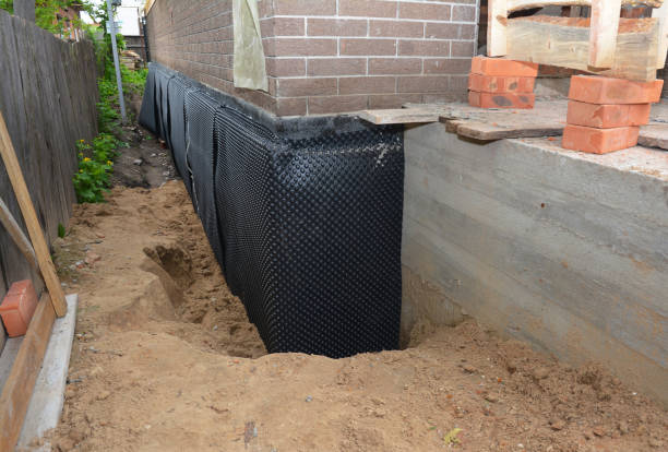 SJ Waterproofing Pros technician performing targeted Waterproofing assessment in Bergen, NY